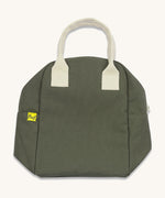 The Fluf organic cotton zippered lunch bag, in a dark olive green with white handles, squashed down flat.