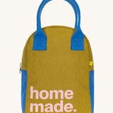 The Fluf organic cotton zippered lunch bag, featuring a home made slogan design on the front, blue handles and blue side panels.