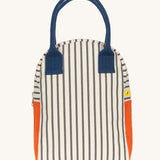 The Fluf organic cotton zippered lunch bag, featuring a nautical pencil stripe design, navy blue handles and orange side panels.