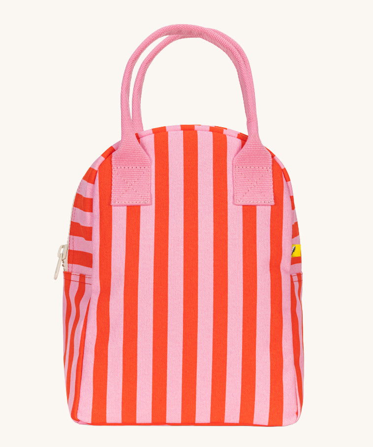 The Fluf organic cotton zippered lunch bag, featuring a pink and red awning stripe design with pink handles.
