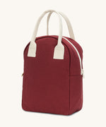 A side view of the Fluf organic cotton zippered lunch bag, in a vintage burgundy colour with a white zip and handles.