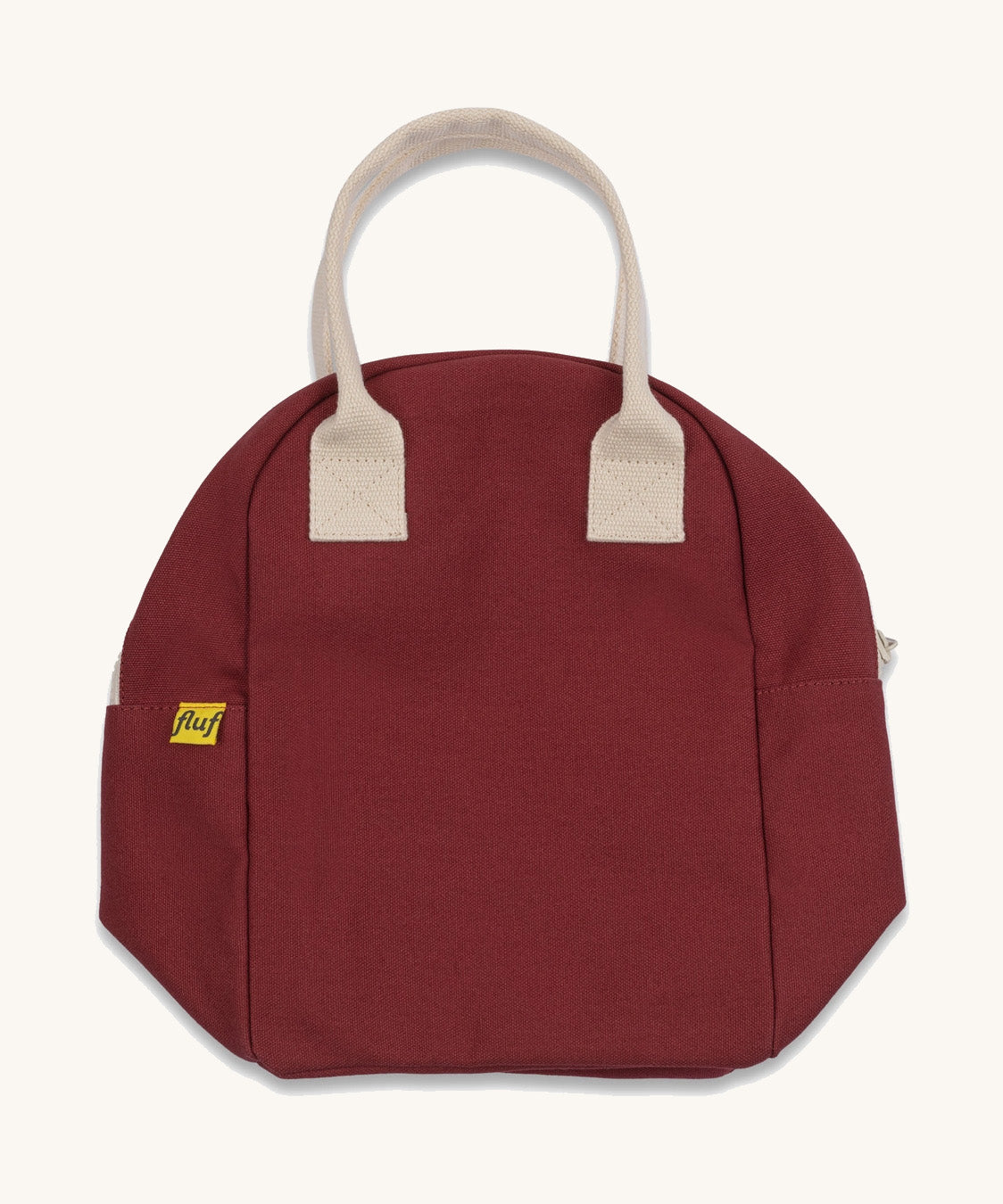 The Fluf organic cotton zippered lunch bag, in a vintage burgundy colour with white handles, squashed flat.