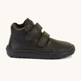 A side image of a Froddo barefoot Autumn children's shoe in black available at Babipur showing the 2 velcro fastener, padded ankle and the matching black sole detail