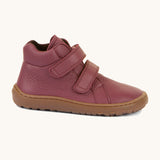 A side image of a Froddo barefoot Autumn children's shoe in bordeaux available at Babipur. A dark purple shoe showing the 2 velcro fastener, padded ankle and the dark brown grippy sole detail