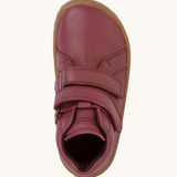 A top down image of a Froddo barefoot Autumn children's shoe in Bordeaux available at Babipur. A dark purple showing the 2 velcro fastener for a secure fit and insole detail.