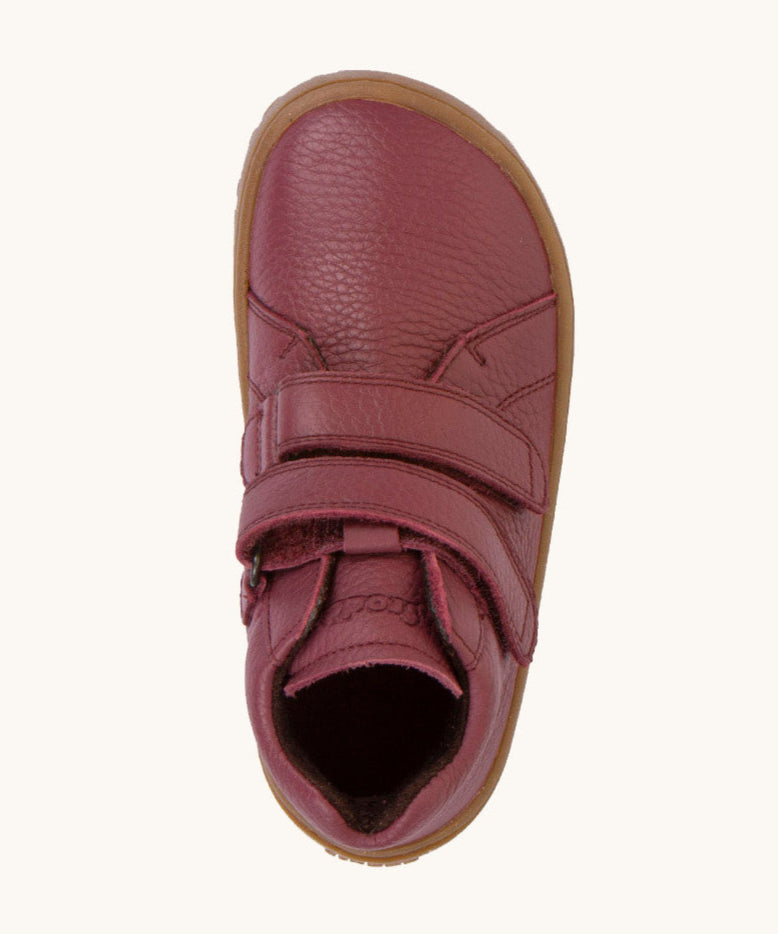 A top down image of a Froddo barefoot Autumn children's shoe in Bordeaux available at Babipur. A dark purple showing the 2 velcro fastener for a secure fit and insole detail.