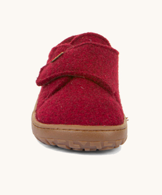 The front of the Froddo barefoot wooly children's shoe in Bordeaux showing the velcro fastener and brown grippy sole detail