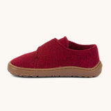 A side image of the Froddo barefoot wooly children's shoe in Bordeaux available at Babipur showing the velcro fastener for a secure fit and a dark brown grippy sole