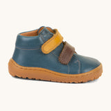 A side image of the Froddo barefoot first step baby shoe in dark denim available at Babipur showing the 2 velcro fastener and padded ankle support detail