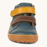 The front of the Froddo barefoot first step baby shoe in dark denim available at Babipur showing the 2 velcro fastener in dark yellow and brown for a secure fit.