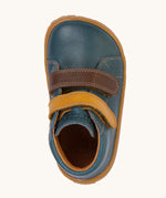 A top down image of the Froddo barefoot first step baby shoe in dark denim available at Babipur showing the 2 velcro fasteners and inner sole detail