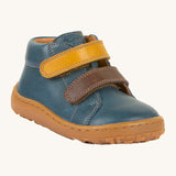 Froddo barefoot first step baby shoe in dark denim. A dark blue natural leather shoe with a 2 velcro fastener in dark yellow and brown for a secure fit. Features a light brown grippy sole