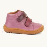 A side image of the Froddo barefoot first step baby shoe in pink available at Babipur. Showing the velcro fasteners and padded ankle detail