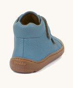 The back of a Froddo barefoot Autumn children's shoe in light blue denim colour available at Babipur showing the padded ankle support and the dark brown grippy sole detail