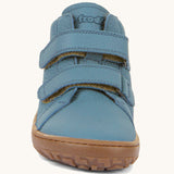 The front of the Froddo barefoot Autumn children's shoe in light blue denim colour available at Babipur showing the 2 velcro fastener detail