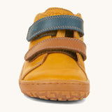 The front of the Froddo barefoot first step baby shoe in mustard available at Babipur showing the 2 velcro fasteners and grippy sole detail