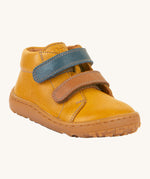 Froddo barefoot first step baby shoe in mustard. A dark yellow natural leather shoe with a 2 velcro fastener for a secure fit in blue and brown and a grippy sole