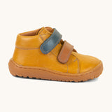 A side image of the Froddo barefoot first step baby shoe in mustard available at Babipur showing the 2 velcro fastener and padded ankle support detail