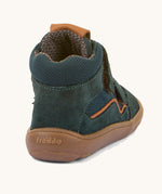 The back of the  Froddo barefoot Tex Autumn children's shoe in petroleum available at Babipur. A dark turquoise shoe showing the padded ankle support and the brown grippy sole detail