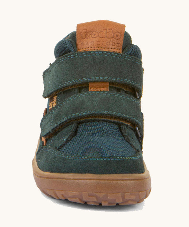 The front of the  Froddo barefoot Tex Autumn children's shoe in petroleum available at Babipur. A dark turquoise shoe showing 2 velcro fasteners on the front and the brown grippy sole detail