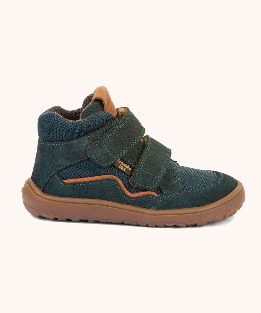 A side image of the Froddo barefoot Tex Autumn children's shoe in petroleum available at Babipur. A dark turquoise shoe showing 2 velcro fasteners on the front for a secure fit, padded ankle and a brown grippy sole.