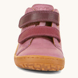 The front of the Froddo barefoot first step baby shoe in pink available at Babipur. Showing the 2 darker pink velcro fastener detail