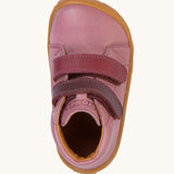 A top down image of the Froddo barefoot first step baby shoe in pink available at Babipur. Showing the velcro strap fasteners and inner sole detail
