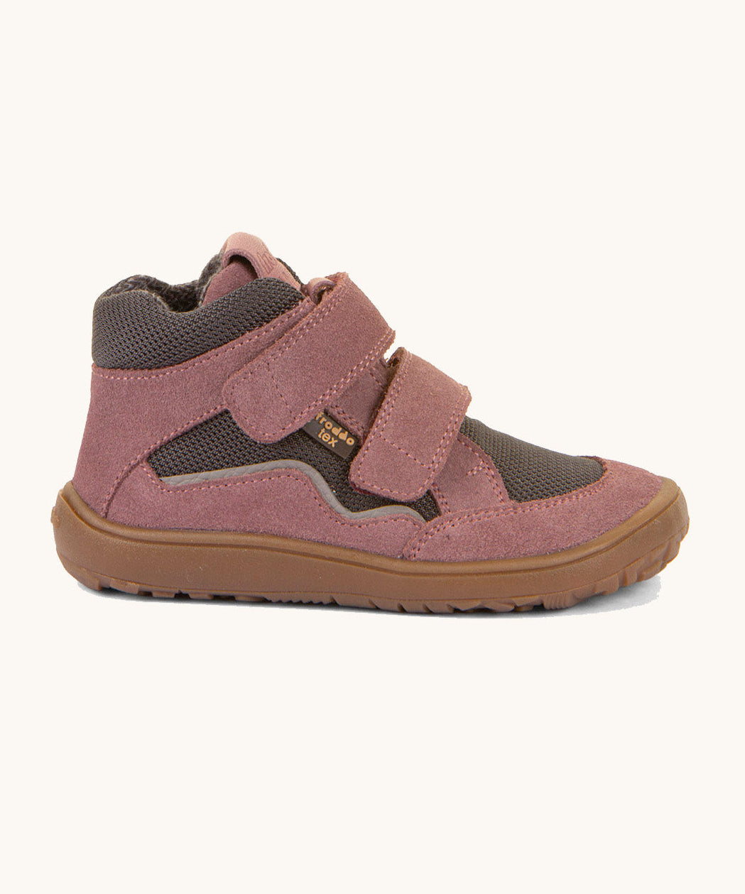 A side image of the Froddo barefoot Tex Autumn children's shoe in pink and grey available at Babipur showing 2 velcro fasteners on the front for a secure fit, padded ankle and a brown grippy sole.