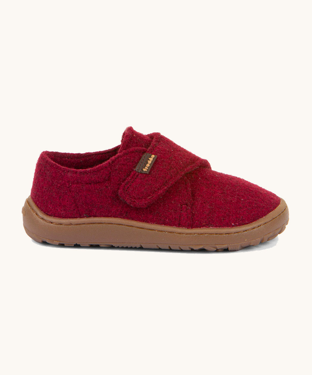 A side image of the Froddo barefoot wooly children's shoe in Bordeaux available at Babipur showing the velcro fastener and grippy sole detail