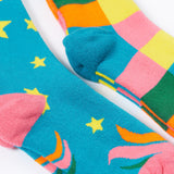 A close up of the Frugi 2 pack rainbow brilliant boot socks showing the pink and light blue heal detail on organic cotton fabric