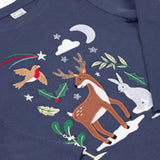 A close up of the reindeer designon the front of the Frugi navy reindeer applique  Organic Cotton Anna long sleeved Top. This top is a part of a wide range of organic cotton clothing for children available here at Babipur.