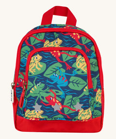 Frugi little adventures backpack in be hoppy. A small navy backpack with red trim and multiple prints of playful frogs. Features 2 compartments and reflective stars