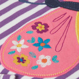 A close up of the embroidered details on the wings of the butterfly applique detail on the front of the Frugi Children's organic cotton Bobby butterfly Applique purple striped  long sleeved Top. The top has a violet purple and white stripe background with a large decorated butterfly applique on the front. This top is a part of a wide range of organic cotton clothing for children available here at Babipur.
