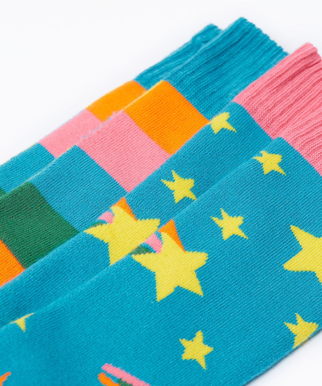 A close up of the Frugi 2 pack rainbow brilliant boot socks showing the print and cuff detail on organic cotton fabric