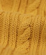 A close up of the cable knit sleeves on the Frugi Caleb leopard Character Knit Organic Cotton Kids' Jumper. This knitted jumper is a part of a wide range of organic cotton clothing for children available here at Babipur.