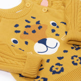 A close up of the leopard's face on the Frugi Caleb leopard Character Knit Organic Cotton Kids' Jumper. This knitted jumper is a part of a wide range of organic cotton clothing for children available here at Babipur.