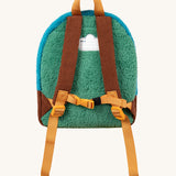 The back of the Frugi kids beary wild backpack. Showing the green fleece back panel with a name patch stitched on the top. Features brown corduroy shoulder staps with a yellow buckle for a secure fit