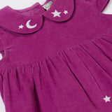 A close up of the embroidered moon and stars details on teh collar of the Frugi Damson purple Flowers Organic Cotton Vali Corduroy children's Dress. This cord kids dress is a part of a wide range of organic cotton clothing for children available here at Babipur.