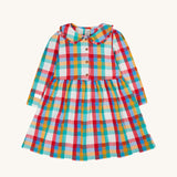 Frugi Rainbow Check Organic Cotton Ffion Dress. The dress has a rounded collar details and button closure on the front. This festive kids dress is a part of a wide range of organic cotton clothing for children available here at Babipur.