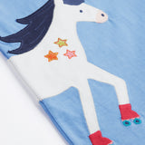 Close up of the Frugi kids cornflower blue, horse t-shirt. Showing the front half appliqué detail on light blue organic cotton fabric.