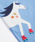 Close up of the Frugi kids cornflower blue, horse t-shirt. Showing the front half appliqué detail on light blue organic cotton fabric.