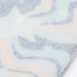 A close up of the Brushback Fleece inside the Frugi Magic Skies Organic Cotton Cosy Flared Leggings. These warm cotton leggings are lined with a Brushback Fleece surface inside. These leggings are part of a wide range of organic cotton clothing for children available here at Babipur.