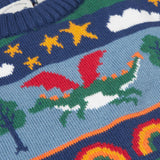 A close up of the green dragon on the Frugi Dragon Fair Isle Organic Cotton Knitted Sweater Vest. A colourful design featuring dragons, rainbows, clouds, stars, toadstools and castles. This sweater vest is a part of a wide range of organic cotton clothing for children available here at Babipur.