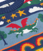 A close up of the green dragon on the Frugi Dragon Fair Isle Organic Cotton Knitted Sweater Vest. A colourful design featuring dragons, rainbows, clouds, stars, toadstools and castles. This sweater vest is a part of a wide range of organic cotton clothing for children available here at Babipur.