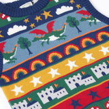 A close up of the front of the Frugi Dragon Fair Isle Organic Cotton Knitted Sweater Vest. A colourful design featuring dragons, rainbows, clouds, stars, toadstools and castles. This sweater vest is a part of a wide range of organic cotton clothing for children available here at Babipur.
