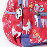 A close up of the Frugi rose unicorn floral explorer backpack showing the bottle holder, compartment zips and gentle white unicorn print detail