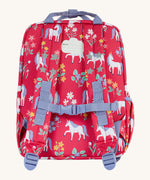 The back of the Frugi rose unicorn explorers backpack. Features a strap with buckle connecting the two shoulder straps for a secure fit and handy carry handle on top