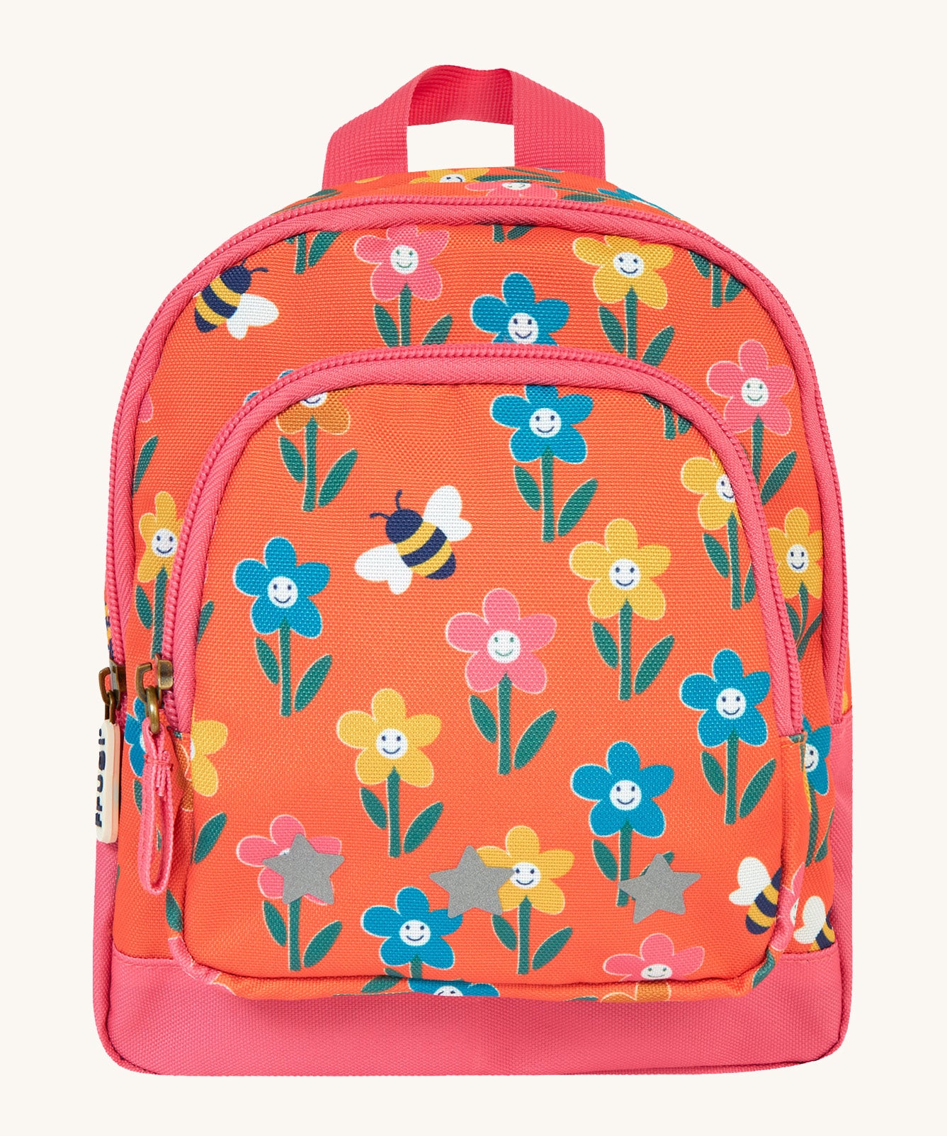 Frugi little adventures backpack in fun flowers. A small orange backpack with pink trim and multiple prints of playful flowers. Features 2 compartments and reflective stars