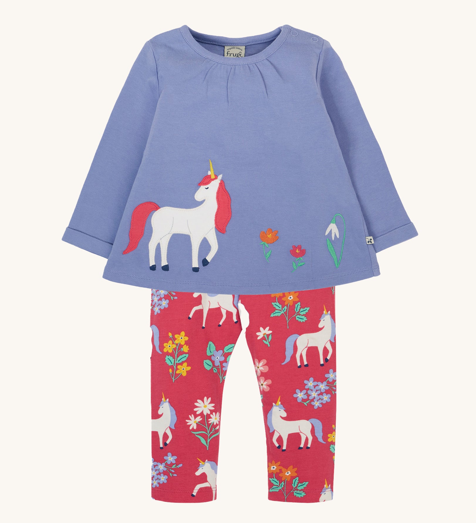 Frugi grape purple unicorn Organic Cotton Ottlie Outfit. An outfit with a purple coloured top with a unicorn applique on the front and pink unicorn print leggings. This outfit is a part of a wide range of organic cotton clothing for children available here at Babipur.
