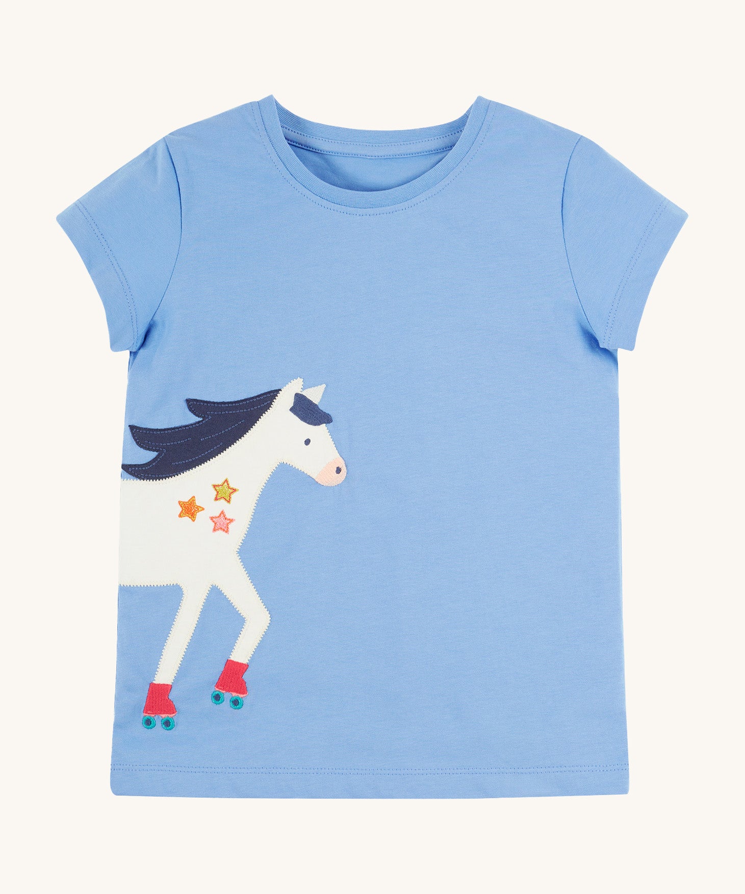 Frugi Elise Wrap Around T-Shirt in cornflower blue – GOTS organic cotton kids' t-shirt with short sleeves, featuring a playful appliqué of a white horse with roller skates that continues from the front to the back.